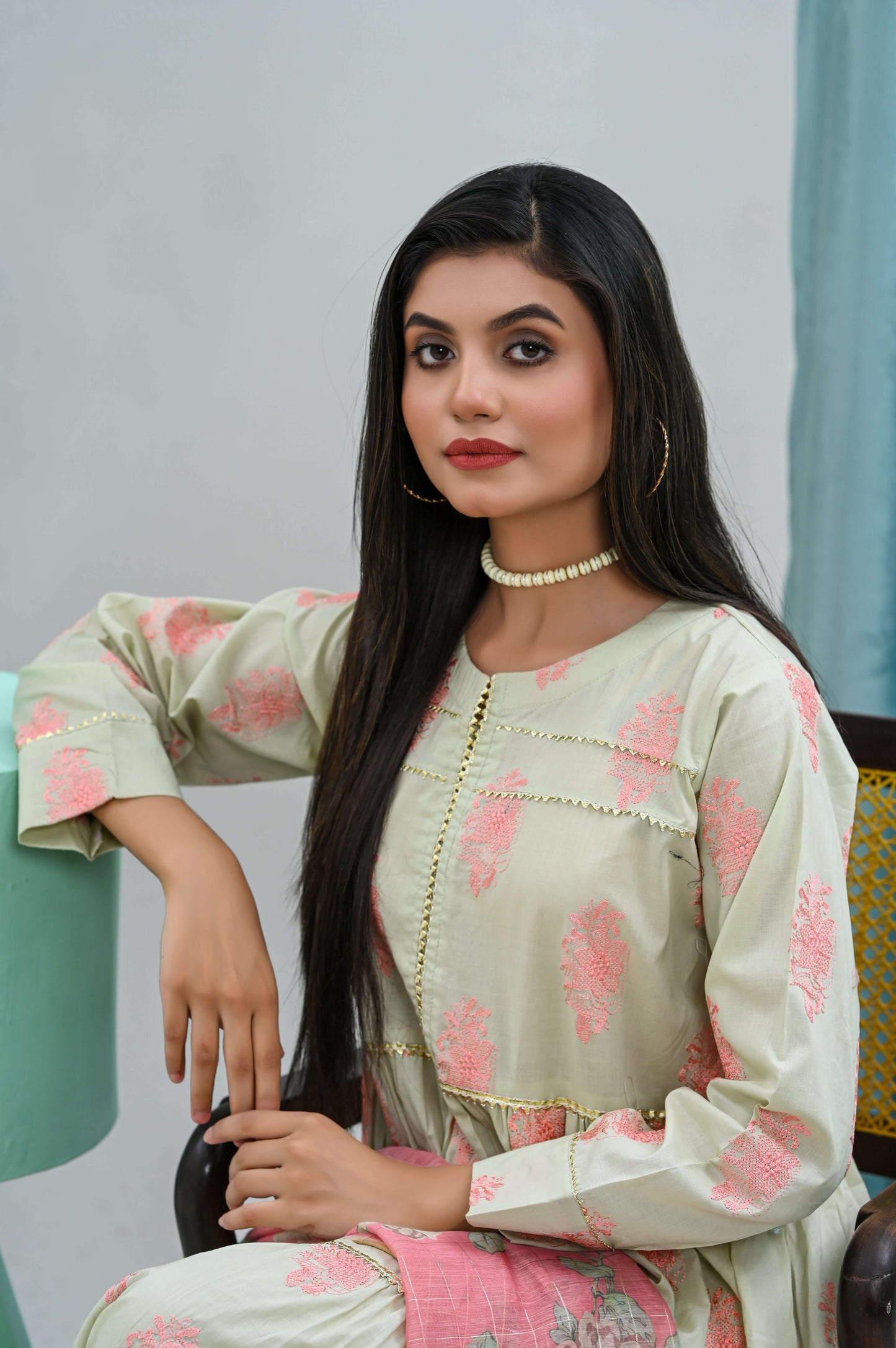Model showcasing a 2-piece light green frock with floral embroidery and matching dupatta, exuding feminine elegance.
